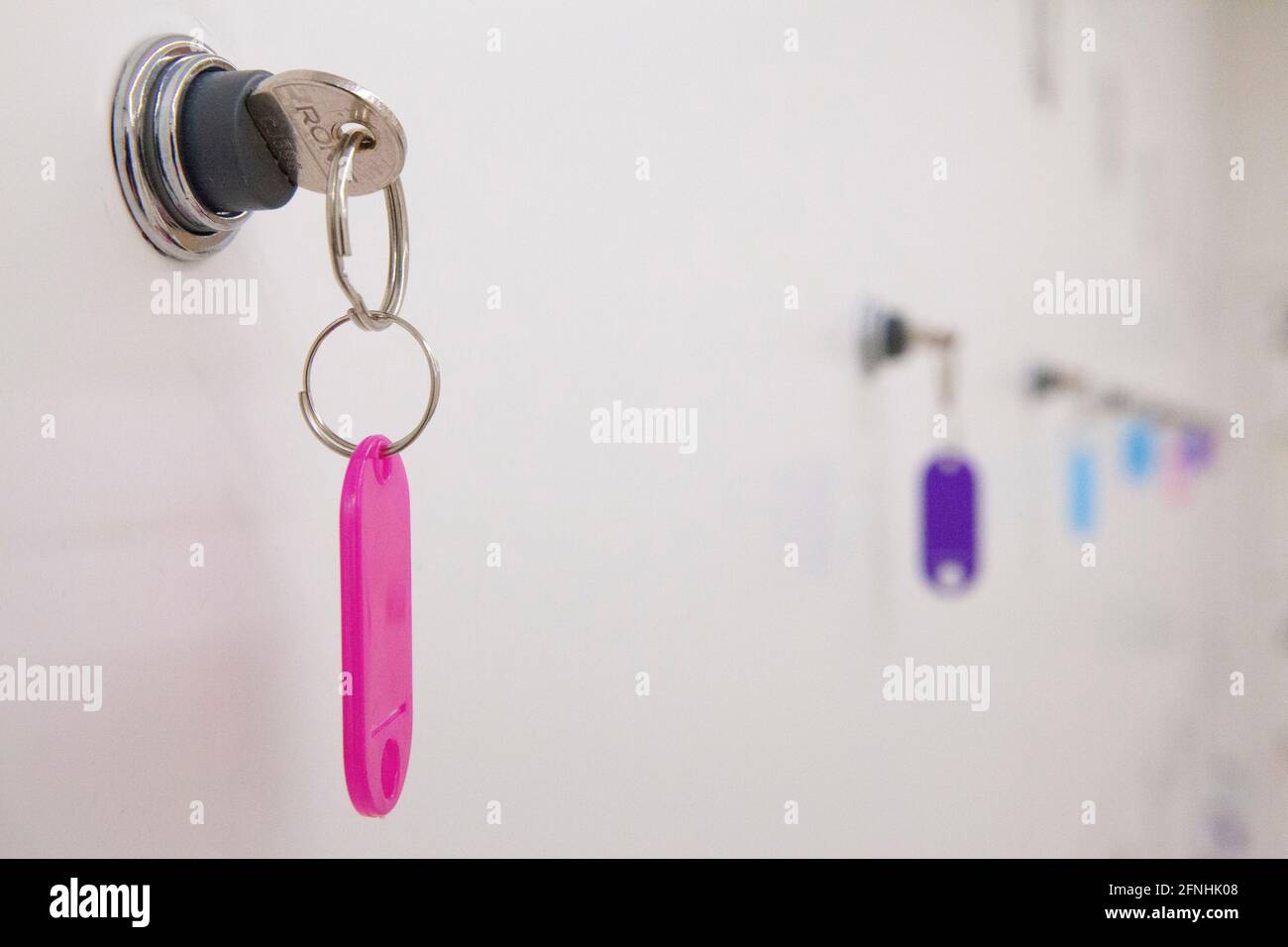 London, UK, 17 May 2021: At the Design Museum visitors can use lockers which have brightly coloured key tags. Anna Watson/Alamy Stock Photo