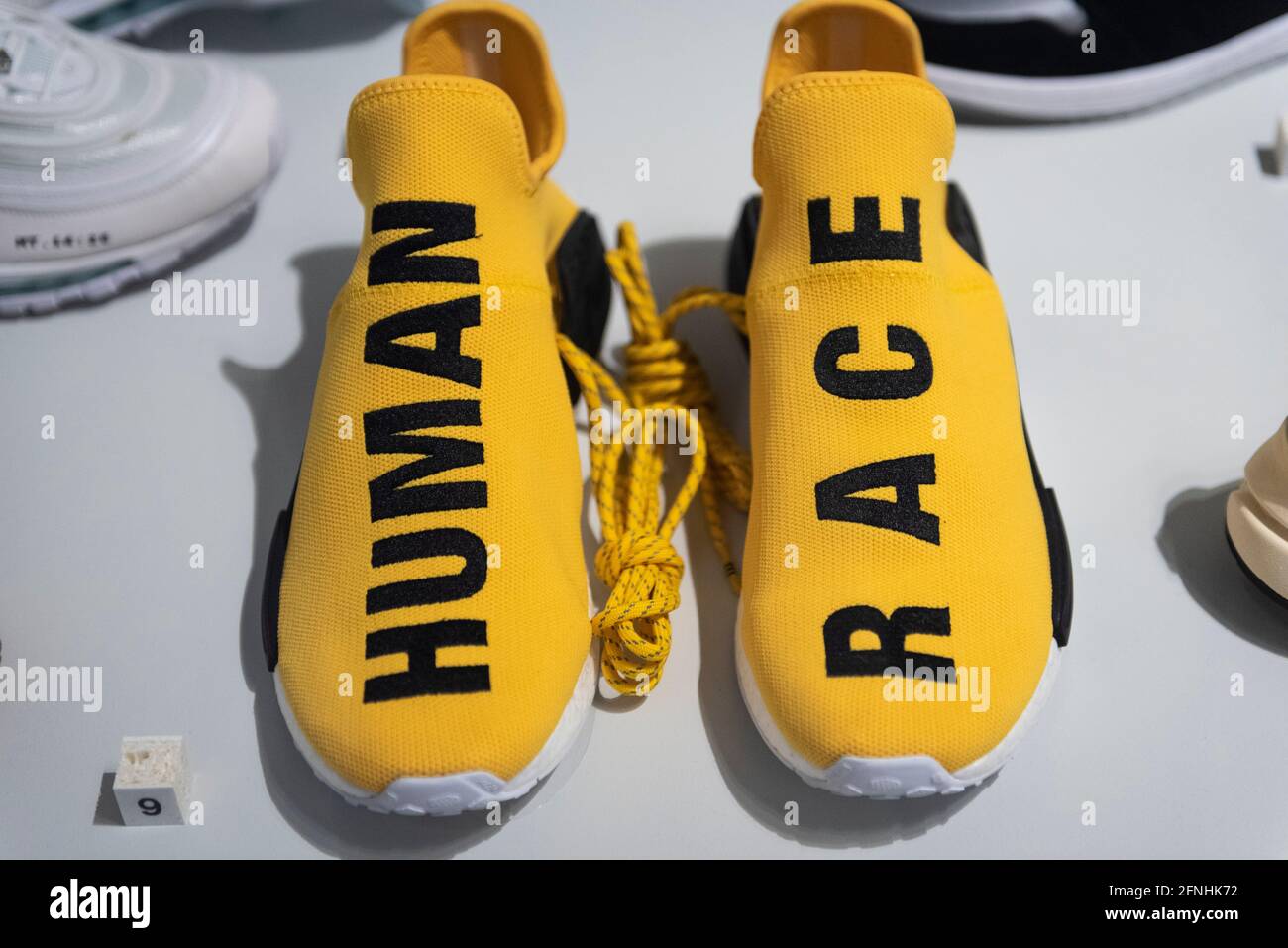 London, UK. 17 May 2021. Adidas NMD HU Pharrell Human Race "Yellow", 2016, a collaboration between Adidas and musician Pharrell Williams. Preview of Unboxed: Studio Street” at the Design Museum