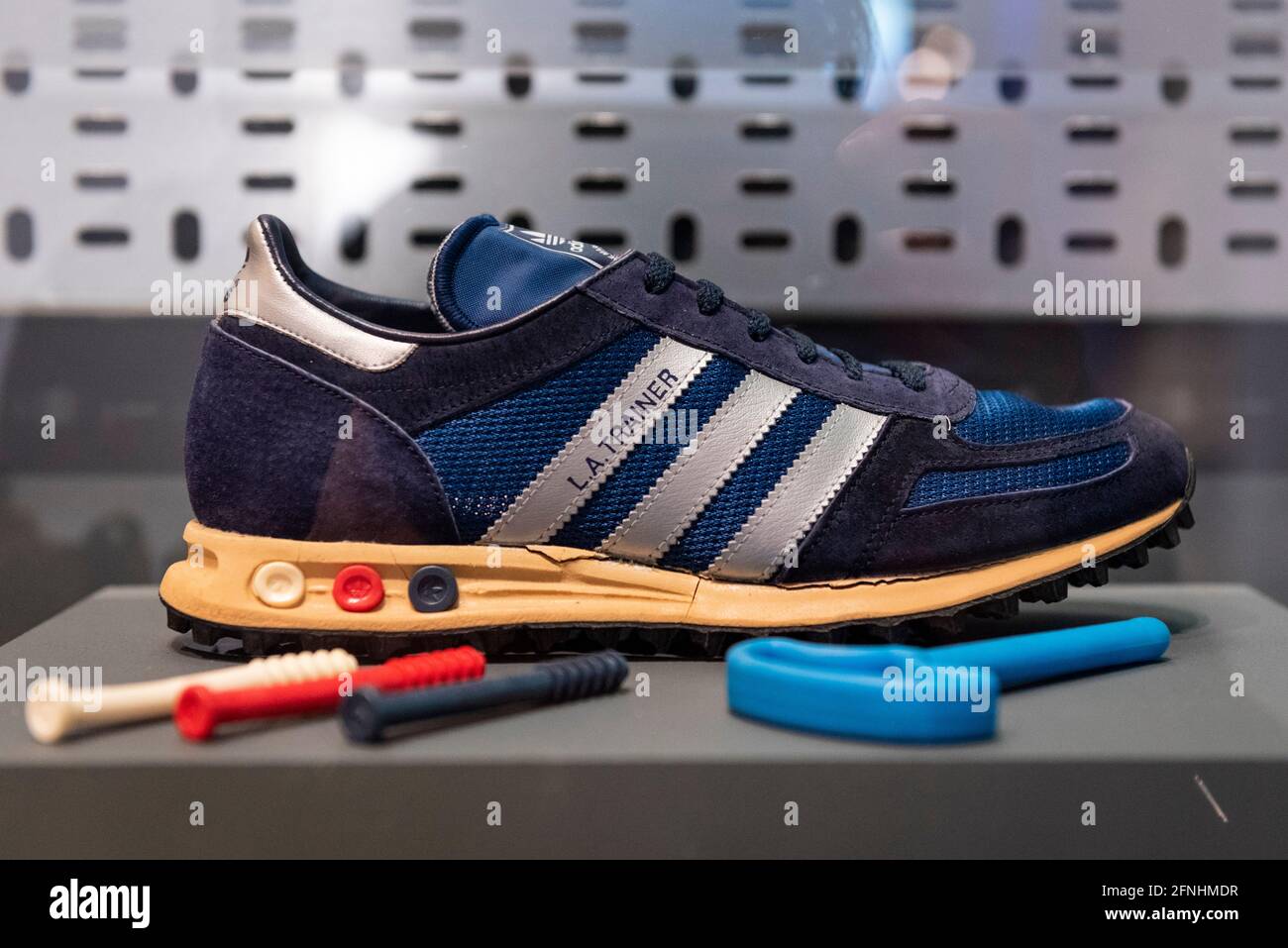 Additive Fore type Onset London, UK. 17 May 2021. "Adidas L.A. trainer", 1985. First released 1984.  With Vario Shock Absorption System pegs. Preview of “Sneakers Unboxed:  Studio to Street” at the Design Museum in Kensington. The