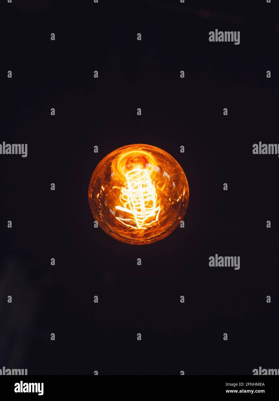 Light bulb on black background Stock Photo Alamy