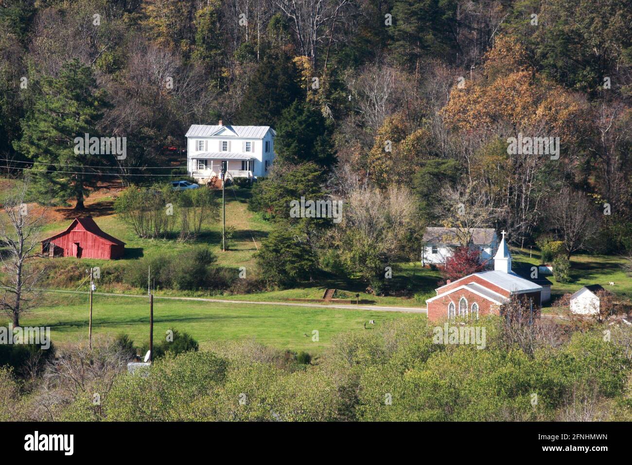 Rural properties and church surrounded by forests in Nelson County, VA, USA Stock Photo