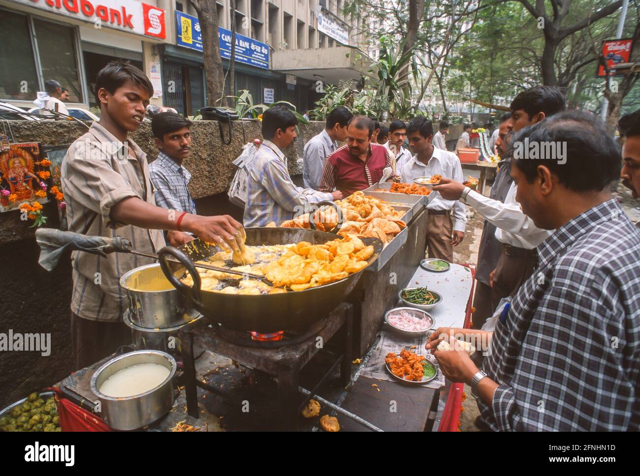 MUMBAI, INDIA - Street vendors cook fried food, Nariman Point neighborhood. Stock Photo