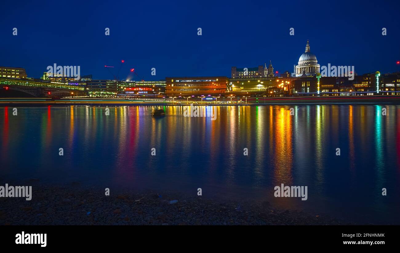 Long exposure, London riverside cityscape with St Paul's cathedral and Blackfriars Millennium Pier Stock Photo