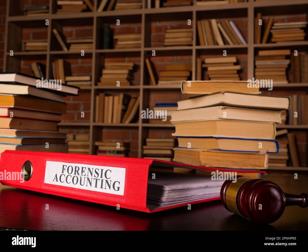 Forensic accounting report in the red folder. Stock Photo