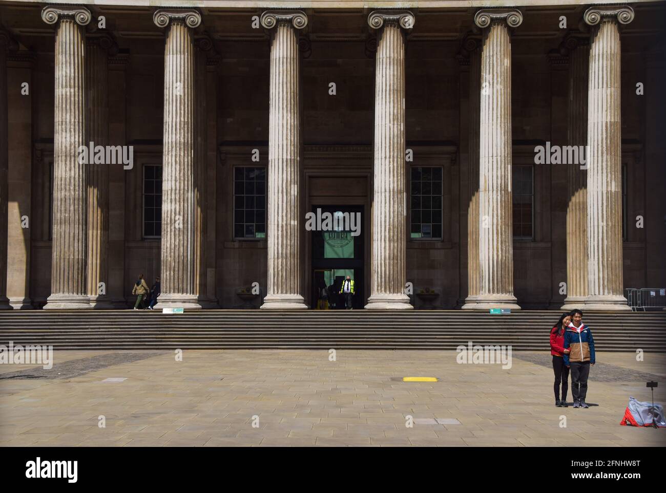 London, United Kingdom. 17th May 2021. Visitors take photos outside the British Museum. Museums and galleries reopened as further lockdown restrictions are lifted in England. Vuk Valcic / Alamy Live News Stock Photo