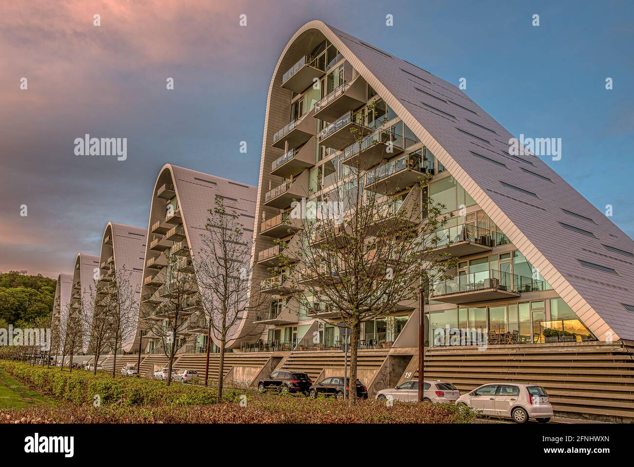 Cars parking in front of the famous apartment block the Wave in Vejle