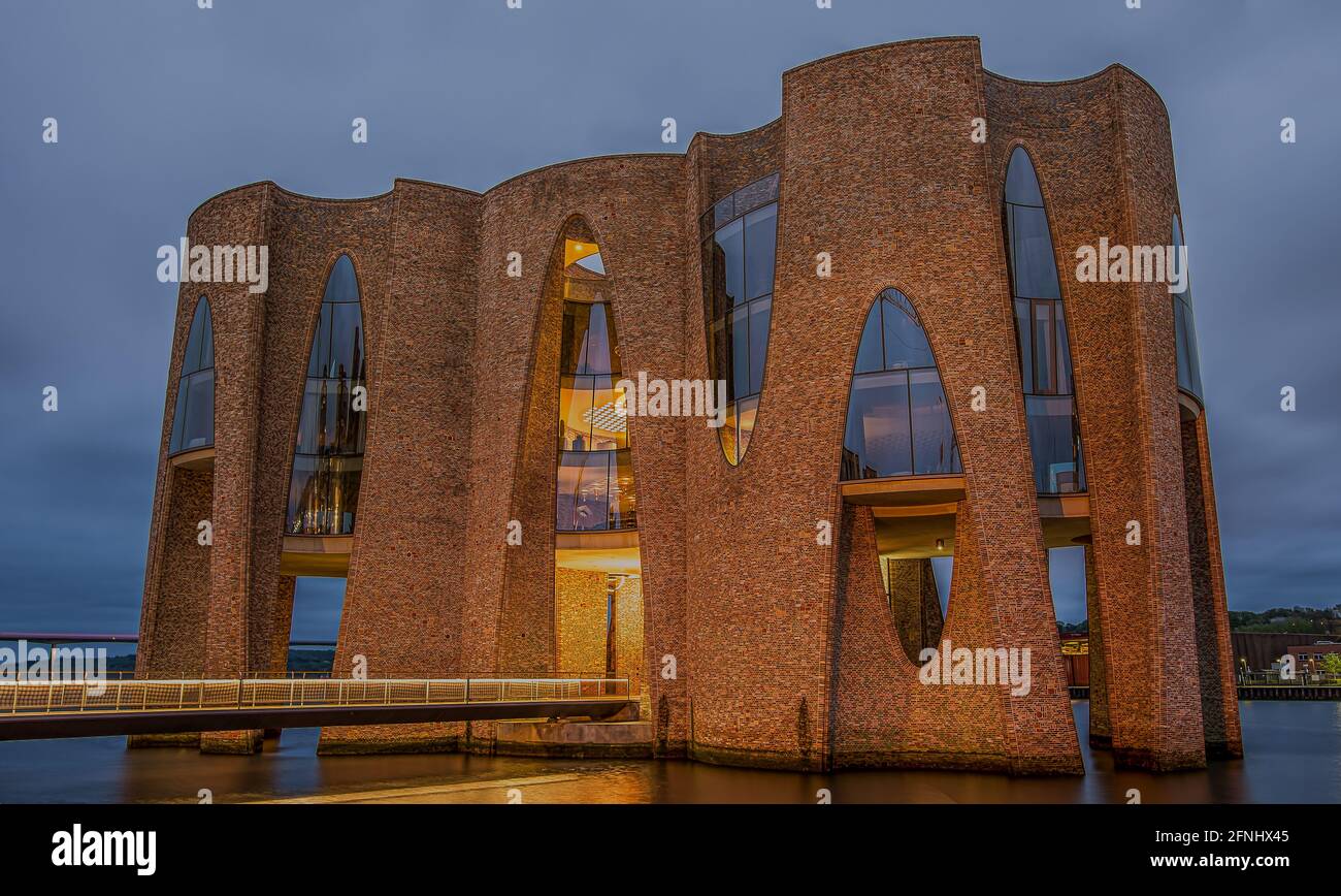 enteance to the iconic building fjordenhus illuminated at night in the ...