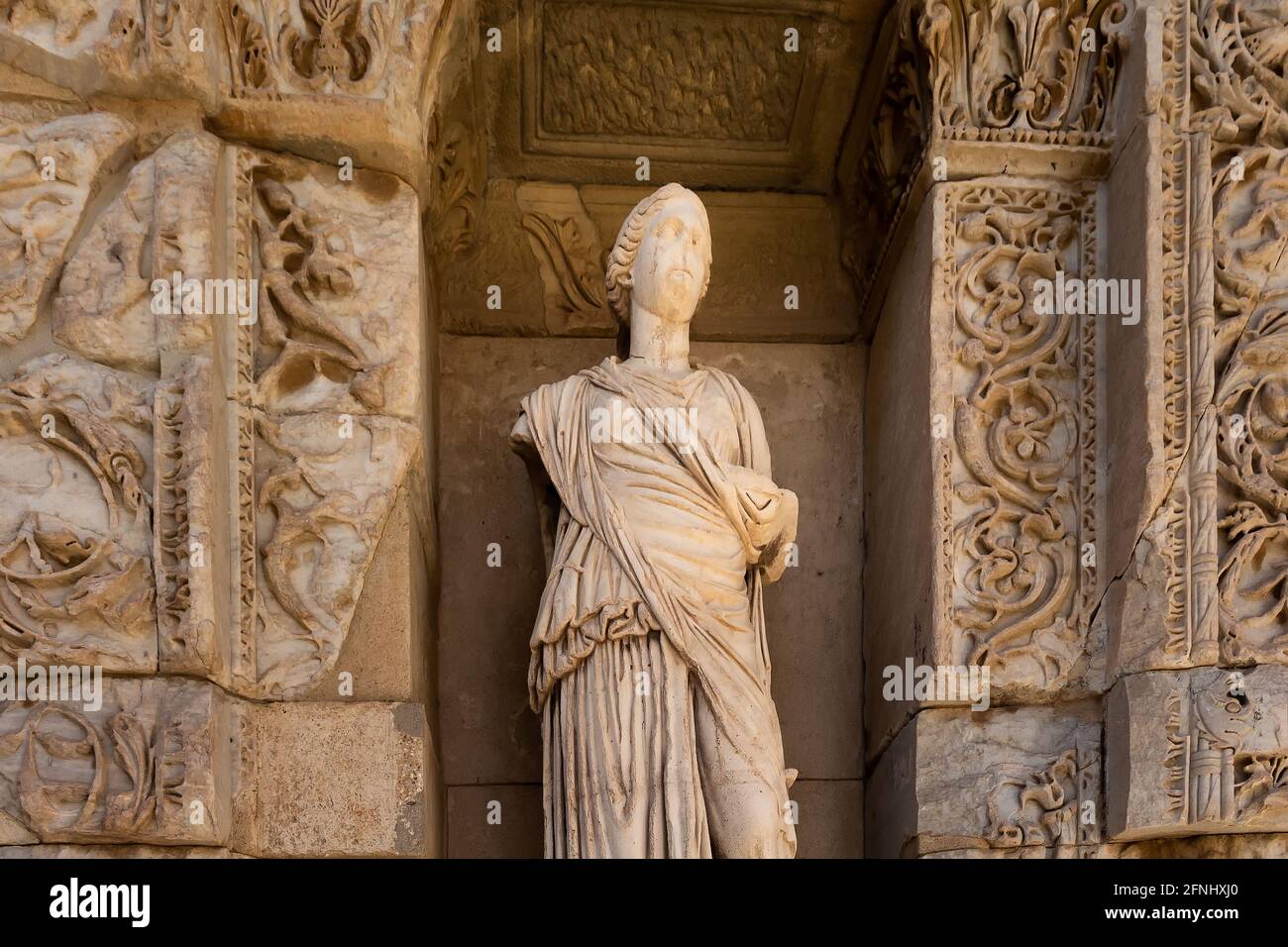 View of a woman statue at the Library of Celsus at famous ancient Greek city called "Ephesus" on the coast of Ionia located southwest of Selcuk in Izm Stock Photo