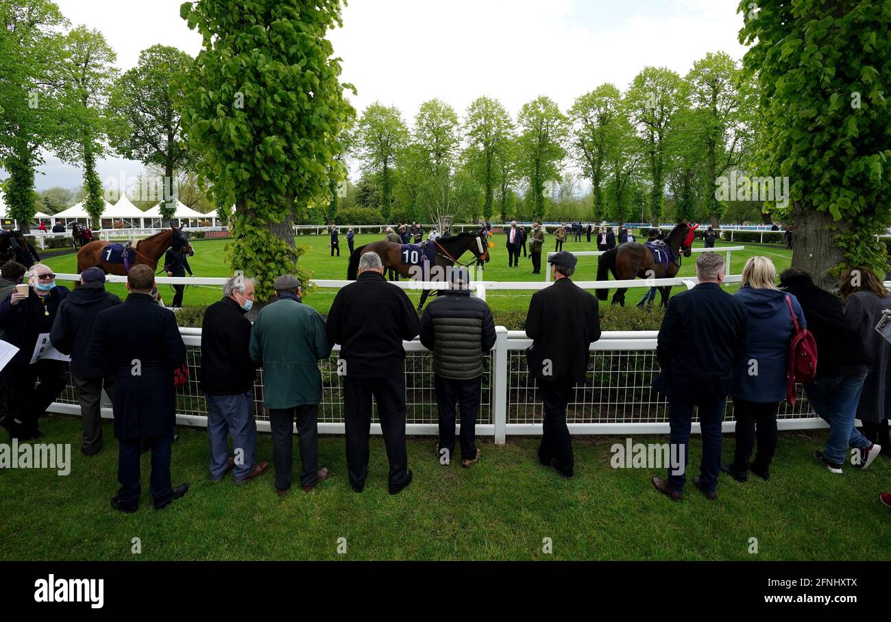 Spectators watch as horse walk around the Parade Ring at Windsor Racecourse. Picture date: Monday May 17, 2021. Fans return to sporting events following the further easing of lockdown restrictions in England. Stock Photo