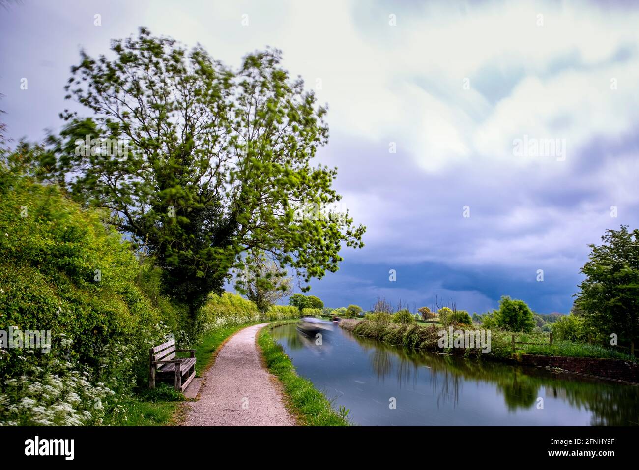 Bench on the Shropshire Union Canal in Middlewich Cheshire UK Stock Photo