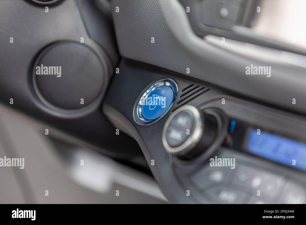 close up of keyless car ignition power button, hybrid vehicle, selective focus Stock Photo