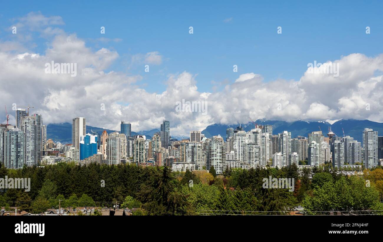 Downtown Vancouver skyline in 2021 with North Shore mountains in background, Vancouver, British Columbia, Canada Stock Photo