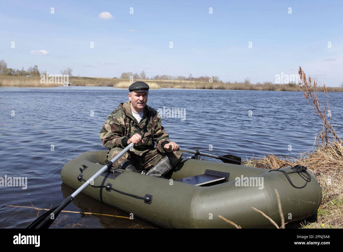 Man is posing on an inflatable boat in summer Stock Photo - Alamy
