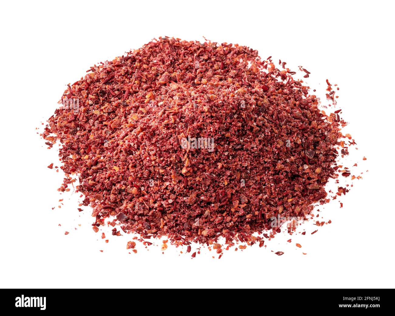 handful of sumac powder closeup on white background Stock Photo Alamy