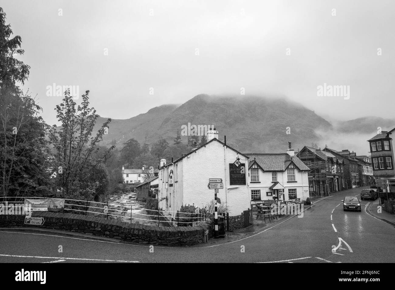 The Black Bull Inn and hotel in Coniston, Cumbria on a rainy day. Stock Photo