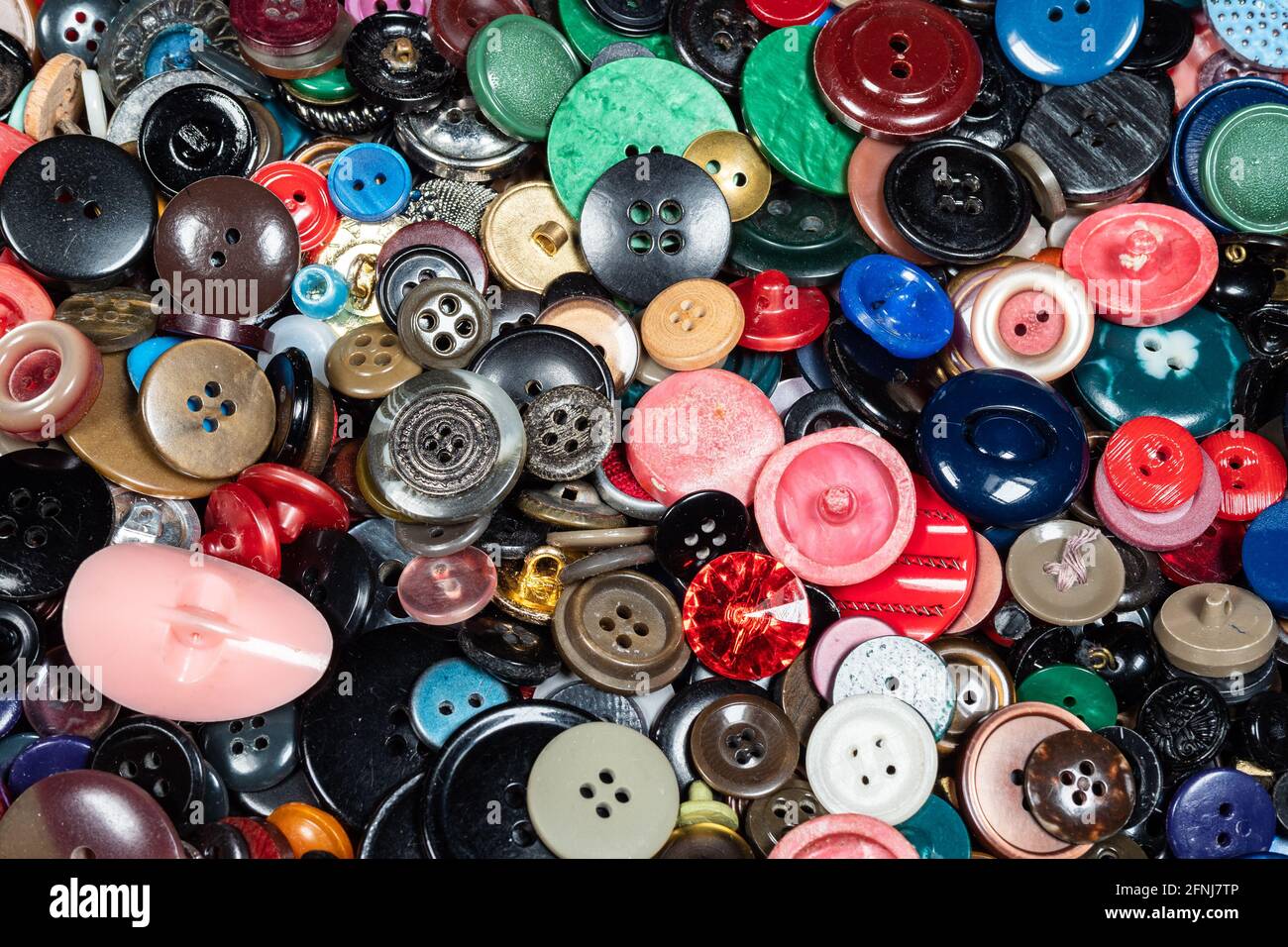 background from many various used buttons closeup Stock Photo
