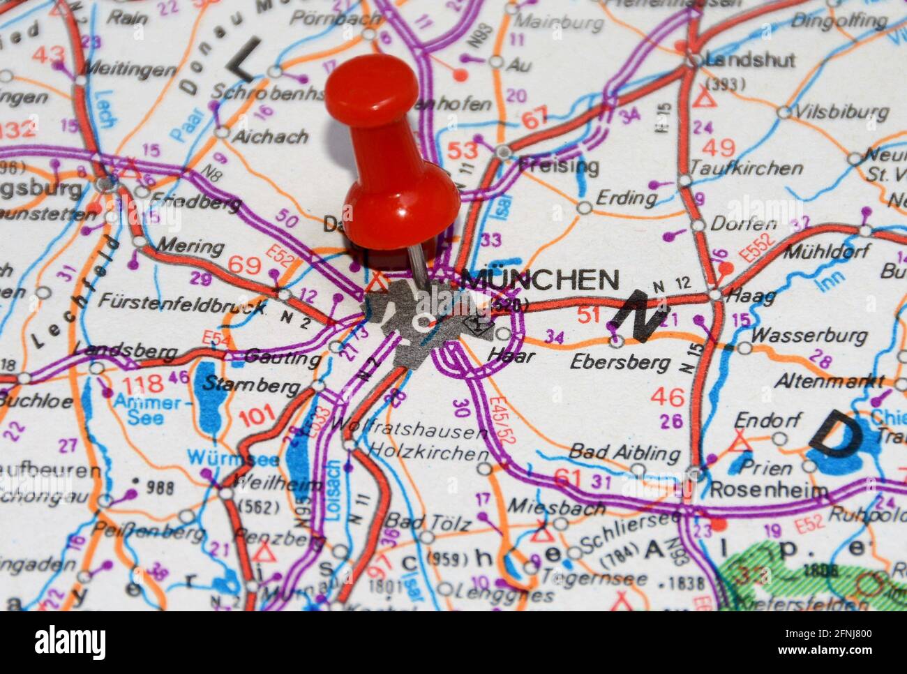 Closeup of a red pushpin on a map marking the location of Munich City in  Germany Stock Photo - Alamy