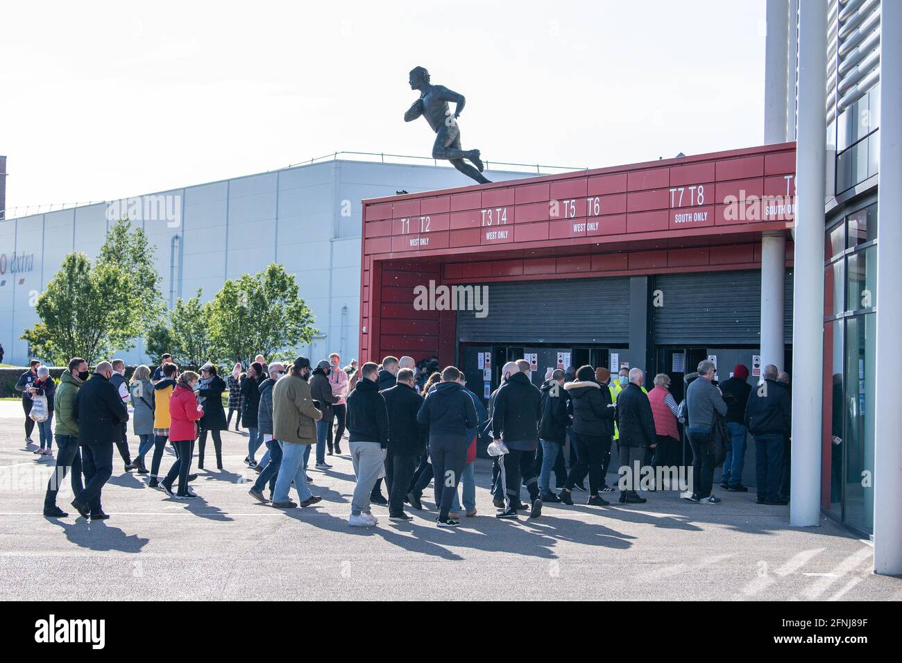 St. Helens fans make there way into the Totally Wicked Stadium, home of St. Helens ahead of tonights game Stock Photo