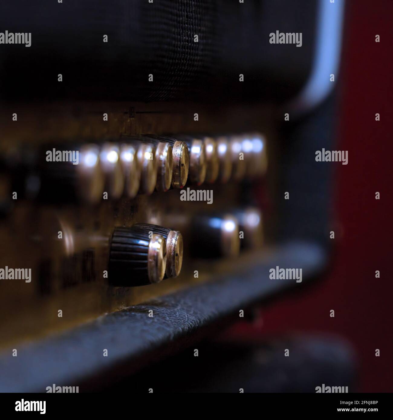 Knobs for volume, tone and various settings on the guitar amp. Guitar combo. Close up. Selective focus Stock Photo