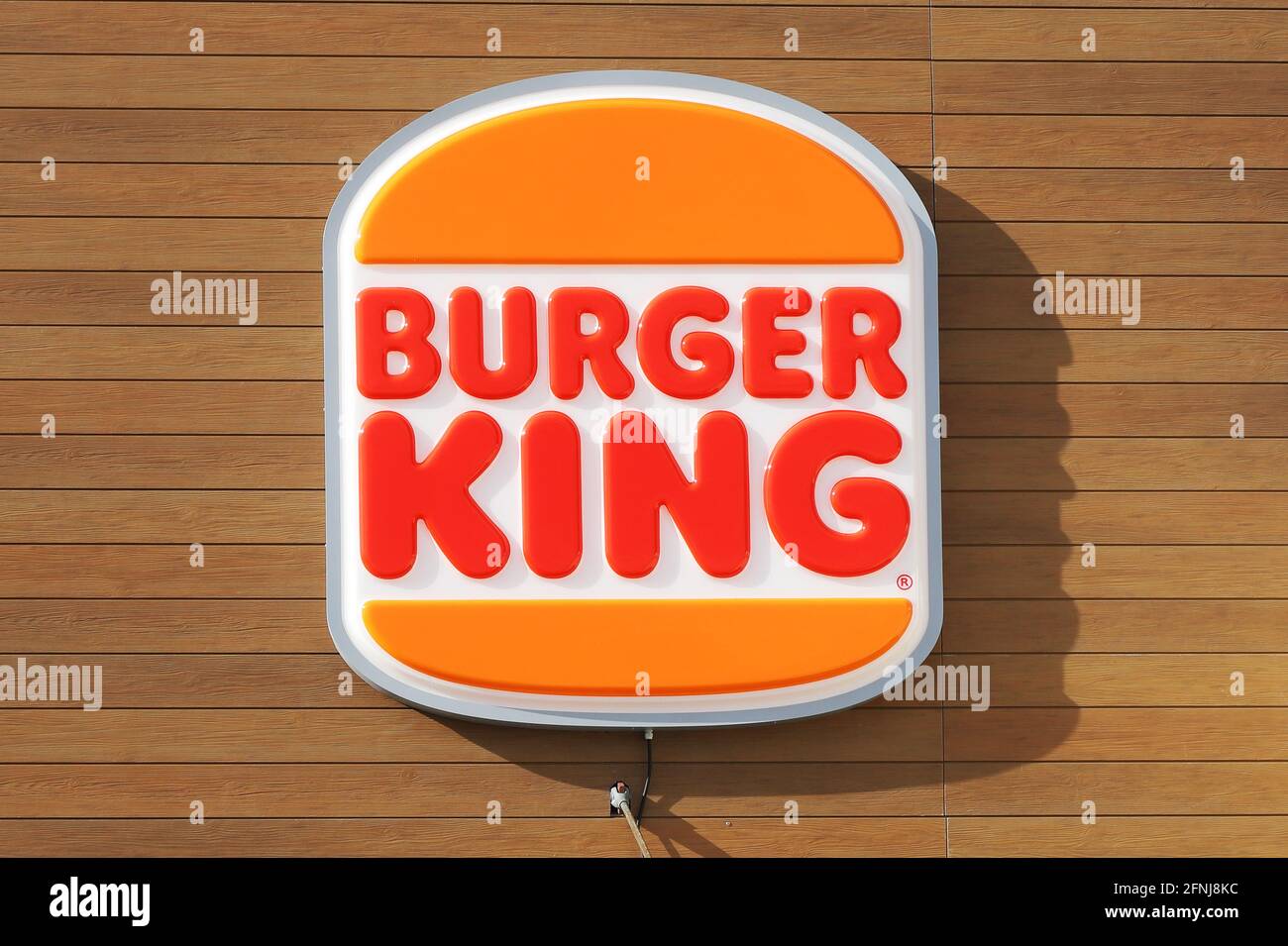 Eskilstuna, Sweden - April 17, 2021: The Burger King new rebranded logo attached to the fast-food restaurant wall. Stock Photo