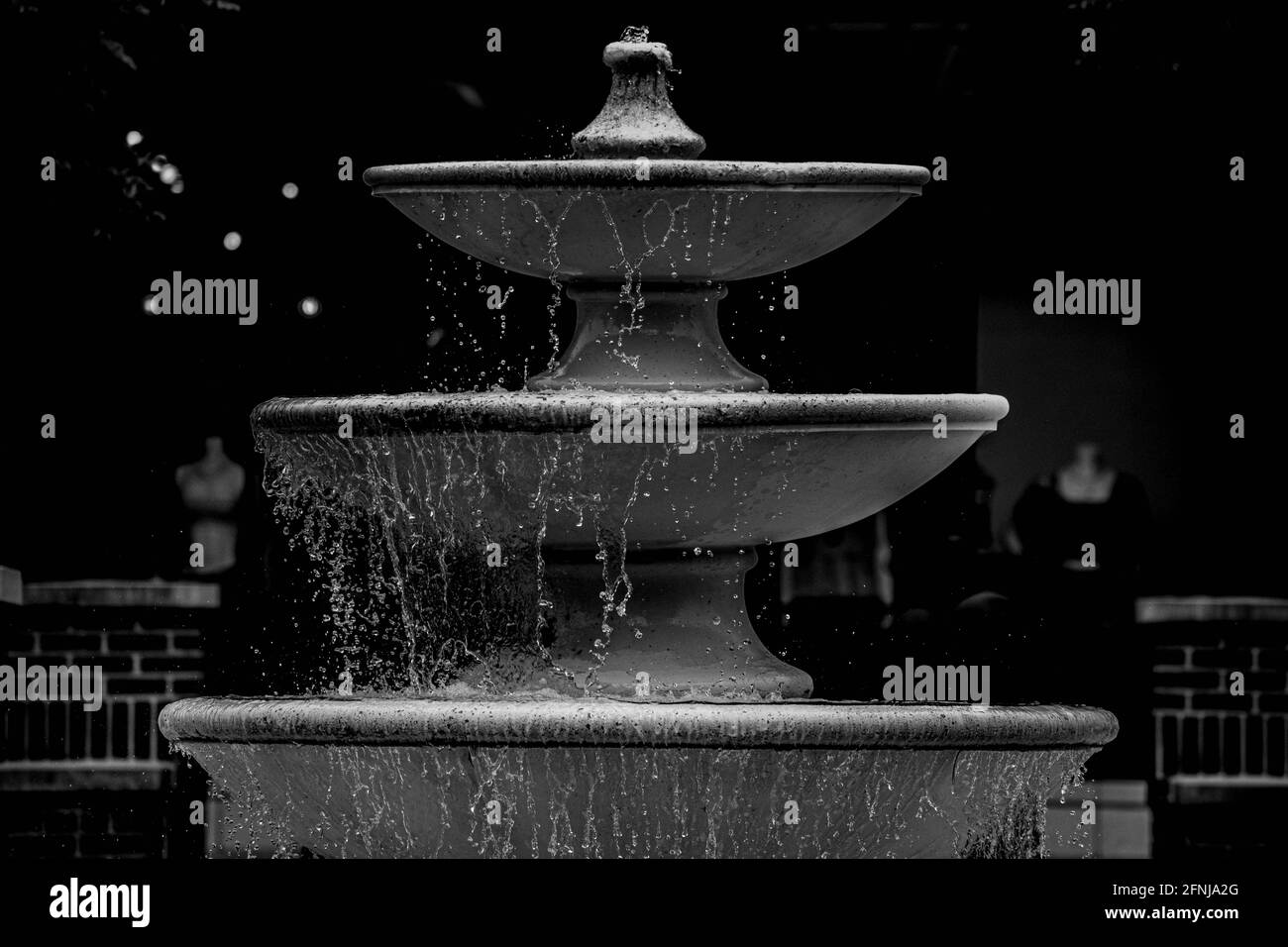 Black and White Water Fountain Captured at the Park. Stock Photo