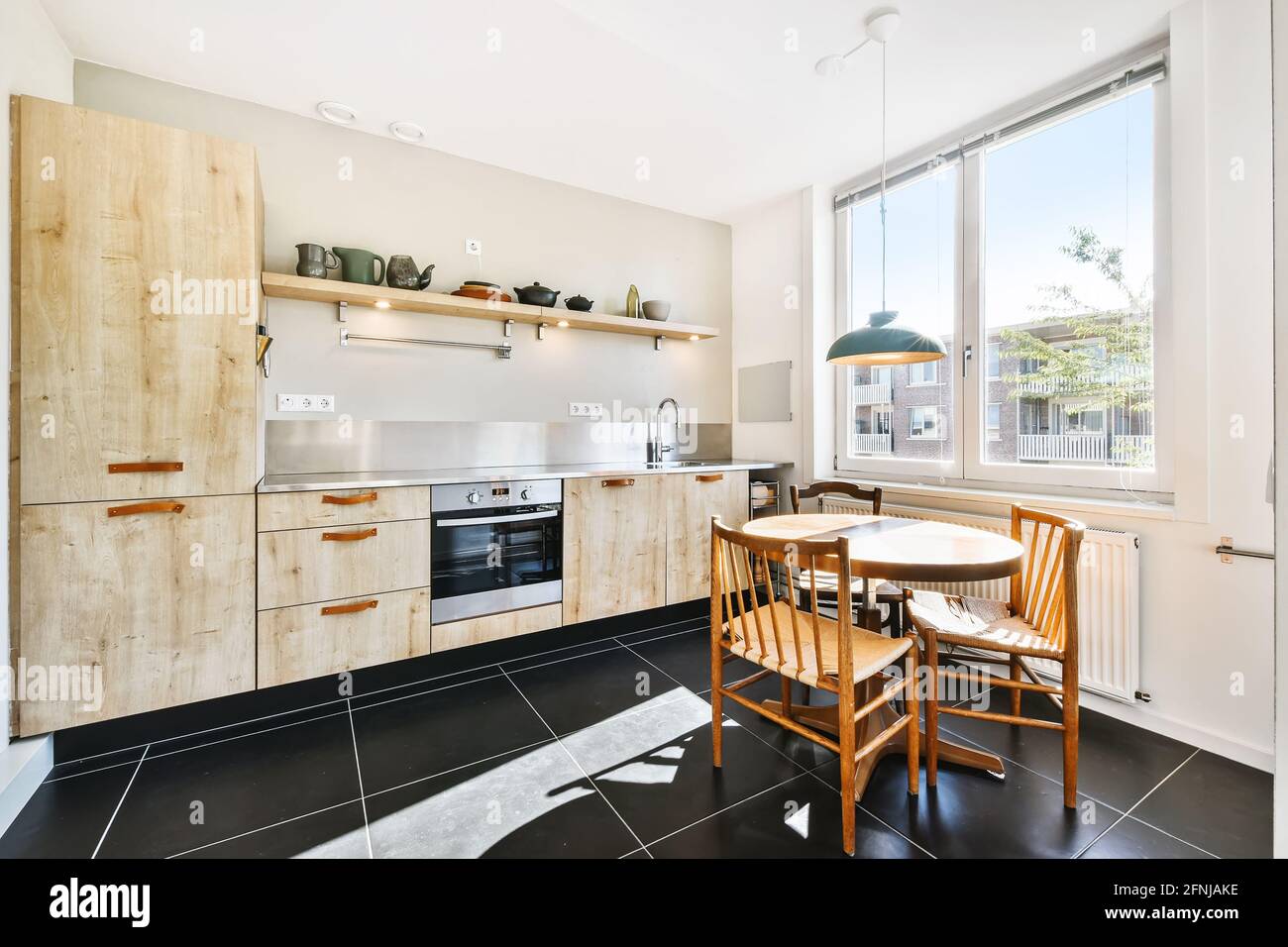 Interior of light modern kitchen Stock Photo - Alamy