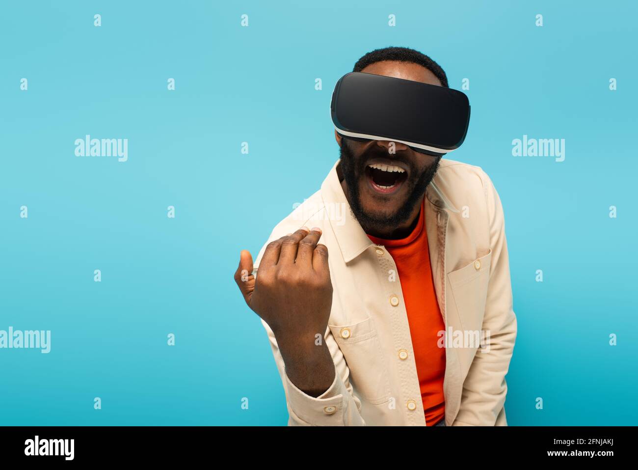 excited african american man in vr headset showing come here gesture ...