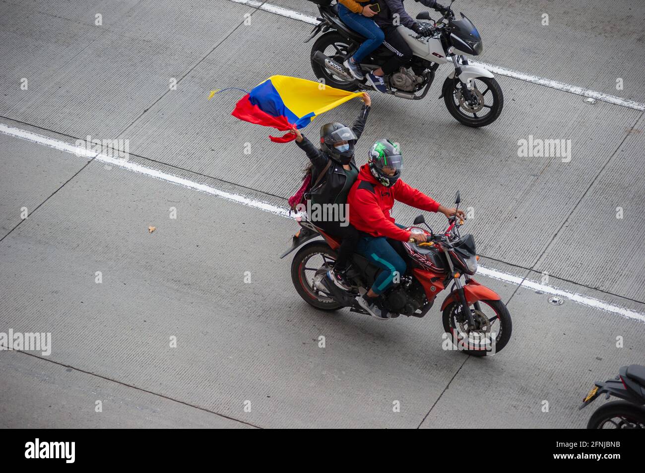 Bikers with Colombian Flags, flood streets of Bogota to celebrate the withdraw of the tax reform of President Ivan Duque, in Bogota, Colombia on May 2, 2021. Stock Photo