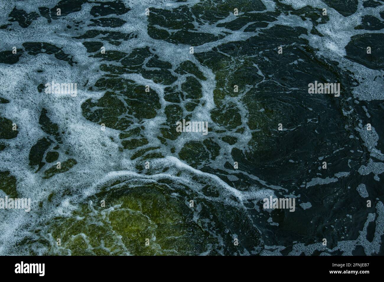 The texture of water on the surface of a small waterfall in the Ukrainian steppe close-up. Tokovsky waterfall is the only steppe waterfall in the worl Stock Photo