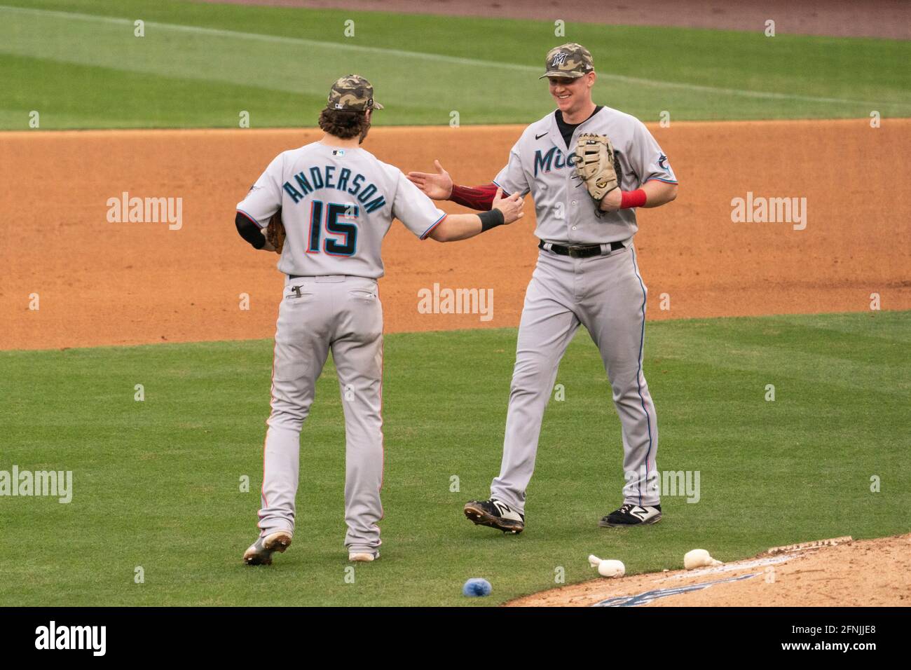 Miami Marlins first baseman Garrett Cooper (26) returns to the dugout  during a baseball game against the St. Louis Cardinals, Thursday, July 6,  2023, in Miami. (AP Photo/Marta Lavandier Stock Photo - Alamy