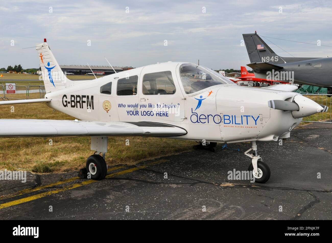 Aerobility Piper PA-28 G-BRFM on static display at Farnborough International Airshow 2010, UK. Air mobility charity Stock Photo