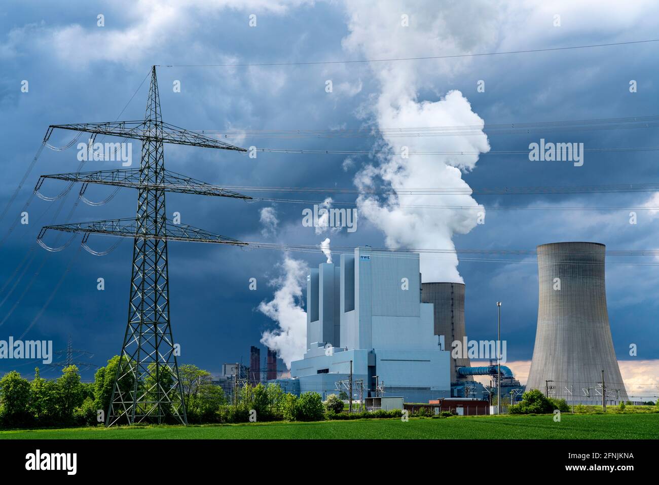 Neurath lignite-fired power plant, near Grevenbroich, RWE Power AG, thunderclouds over the Rhenish lignite mining area, field, NRW, Germany, Stock Photo