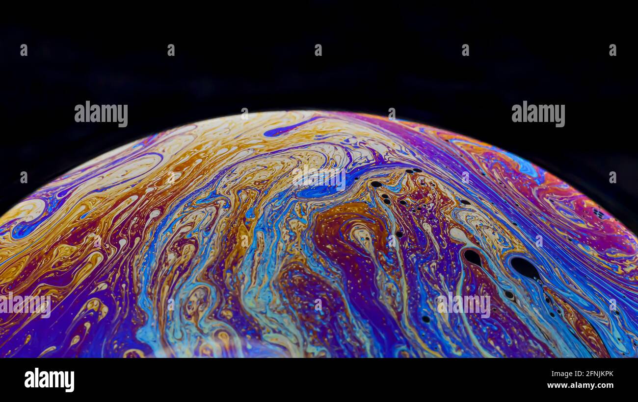Beautiful psychedelic abstractions on the surface soap bubbles Stock Photo