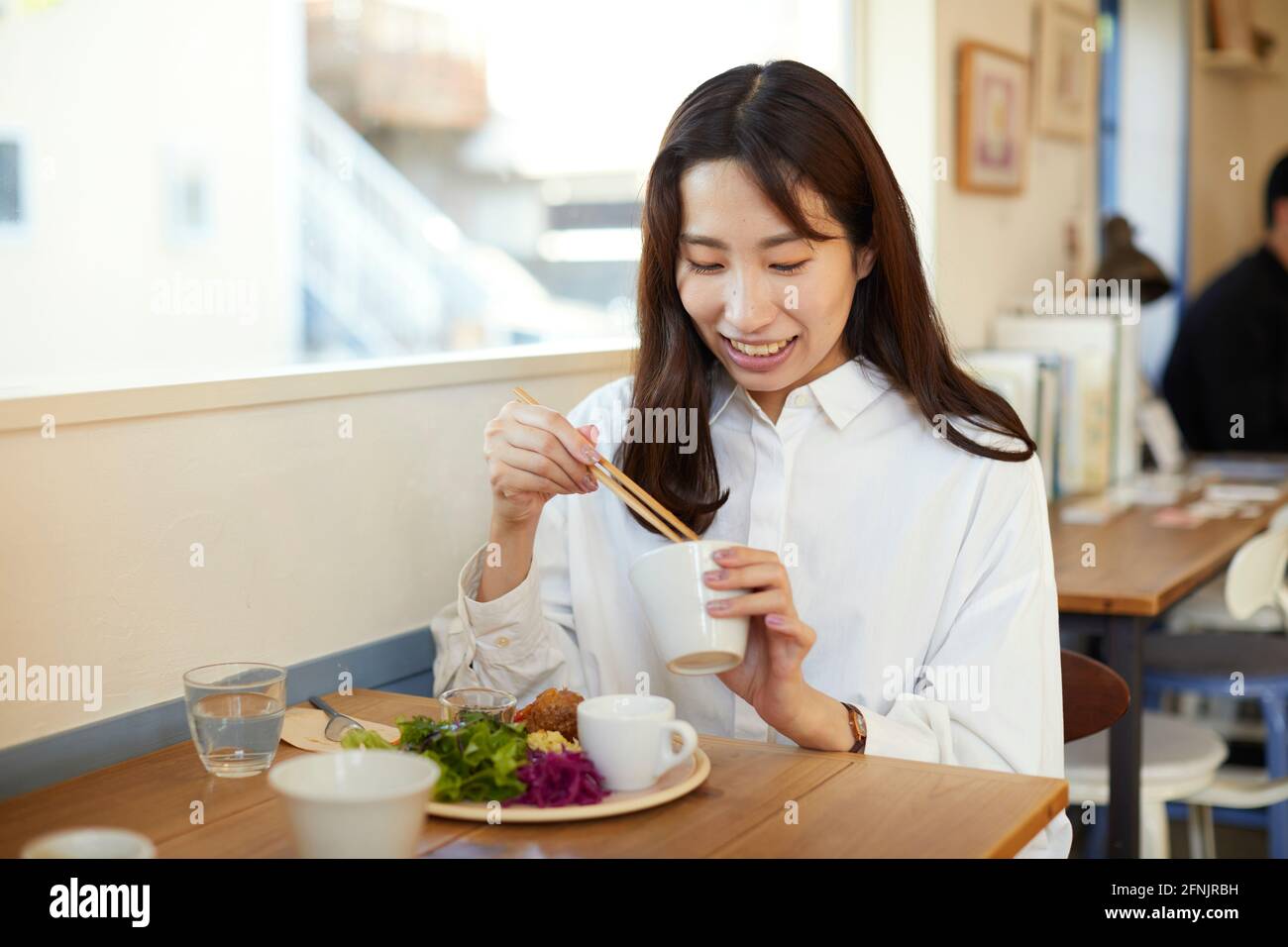 Young Japanese woman at a cafe Stock Photo - Alamy