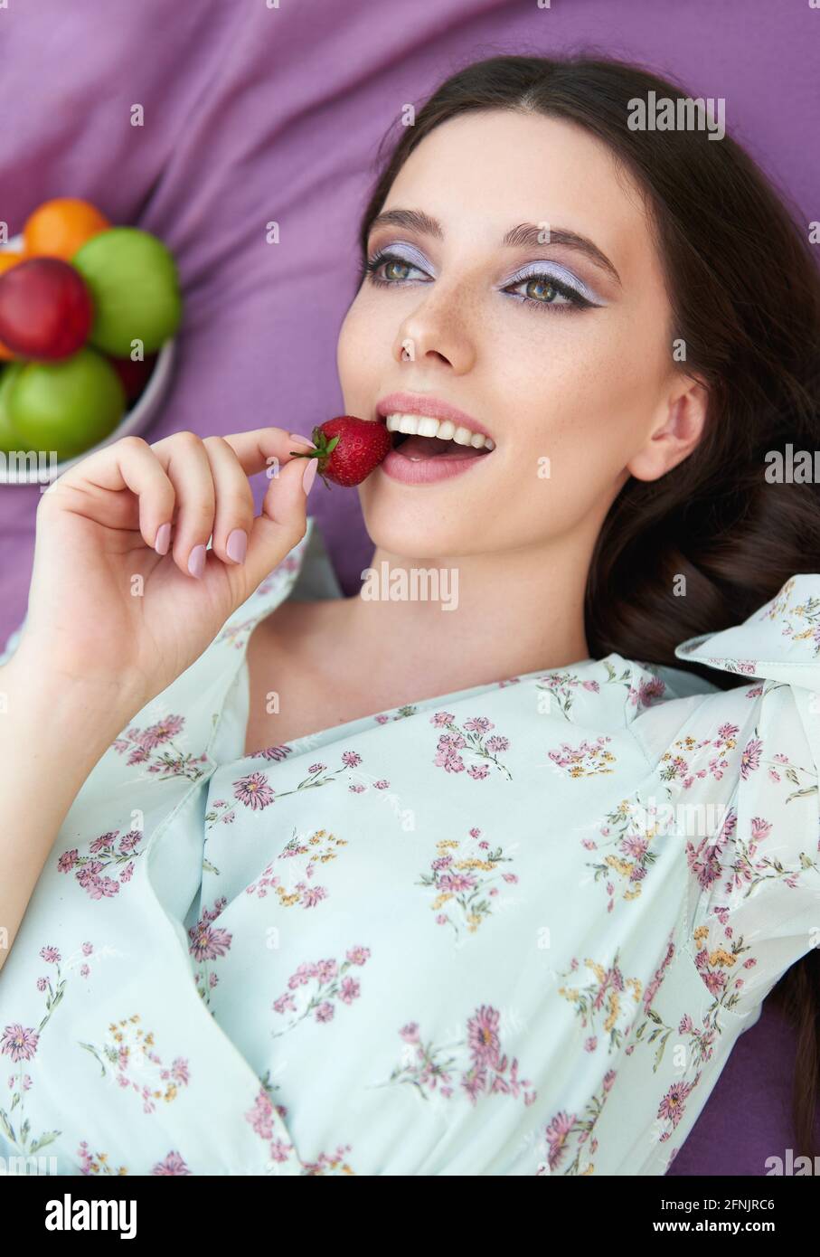 Pretty Smiling Girl Eats Strawberry Close up Portrait Of The Beautiful Pretty Smiling Girl Eats Strawberry Close up Portrait Of The Beautiful