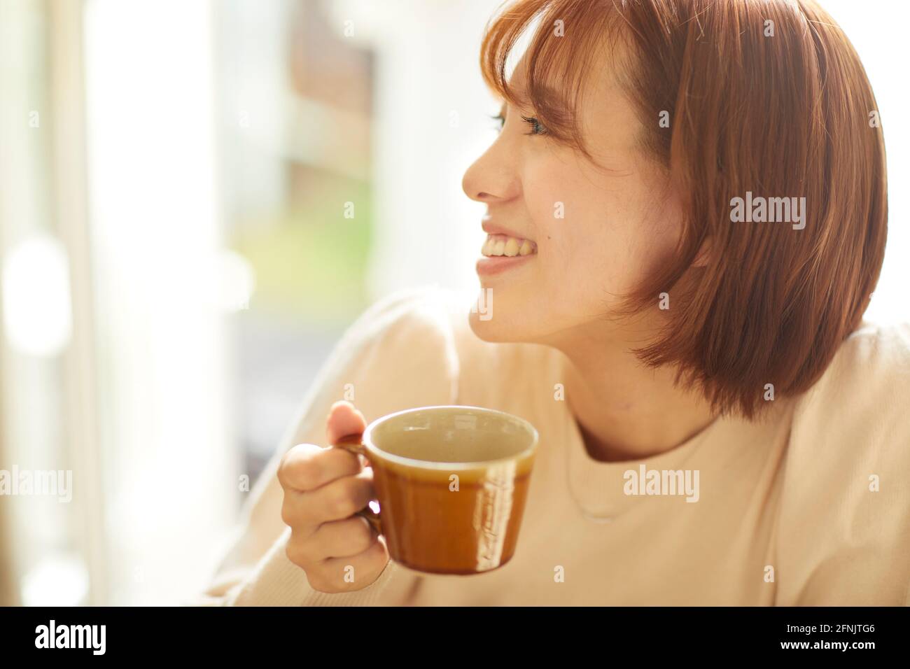 Young Japanese woman at a cafe Stock Photo - Alamy