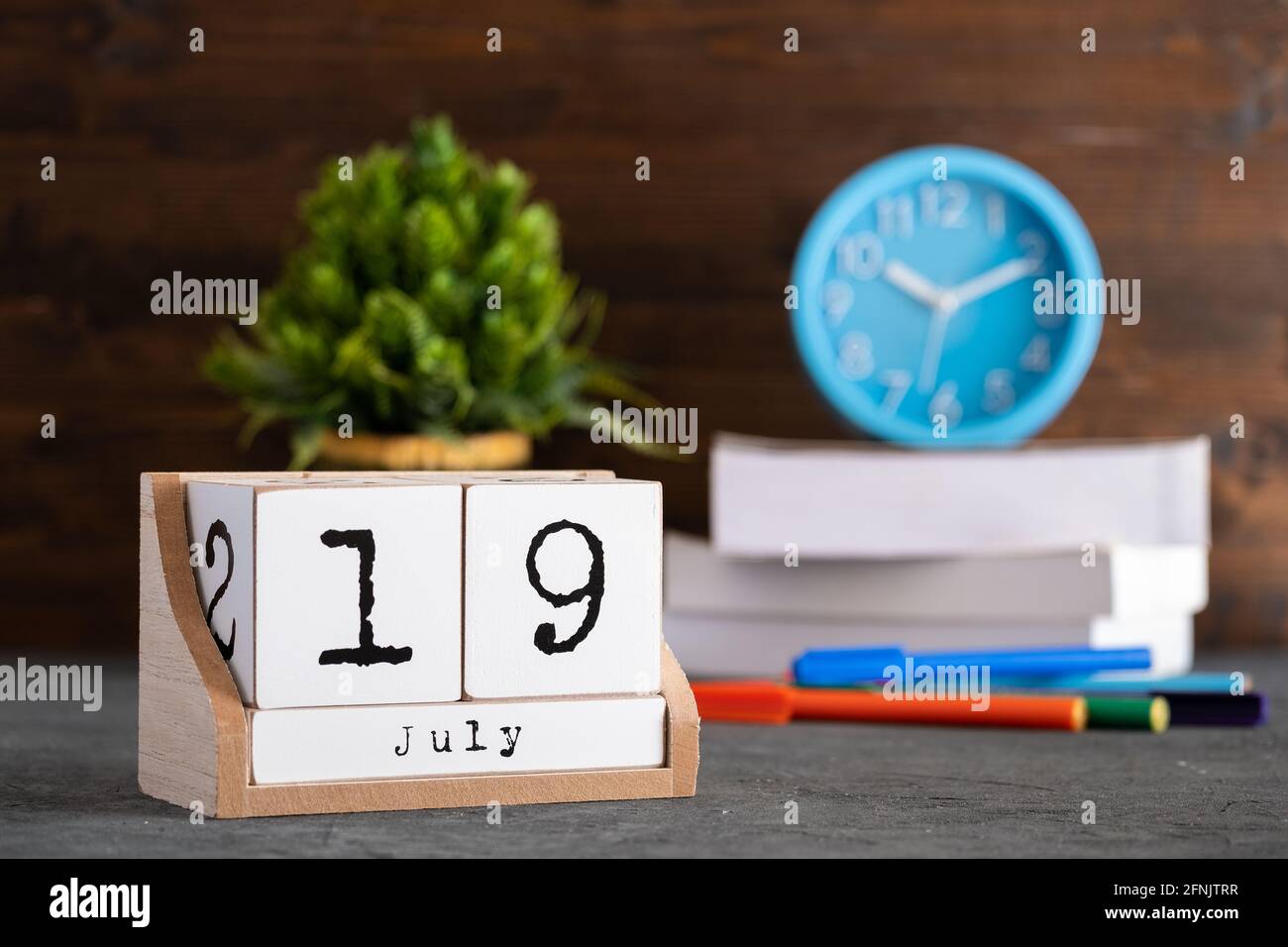 July 19 calendar date text on wooden blocks with blurred background park. Concept Stock Photo - Alamy
