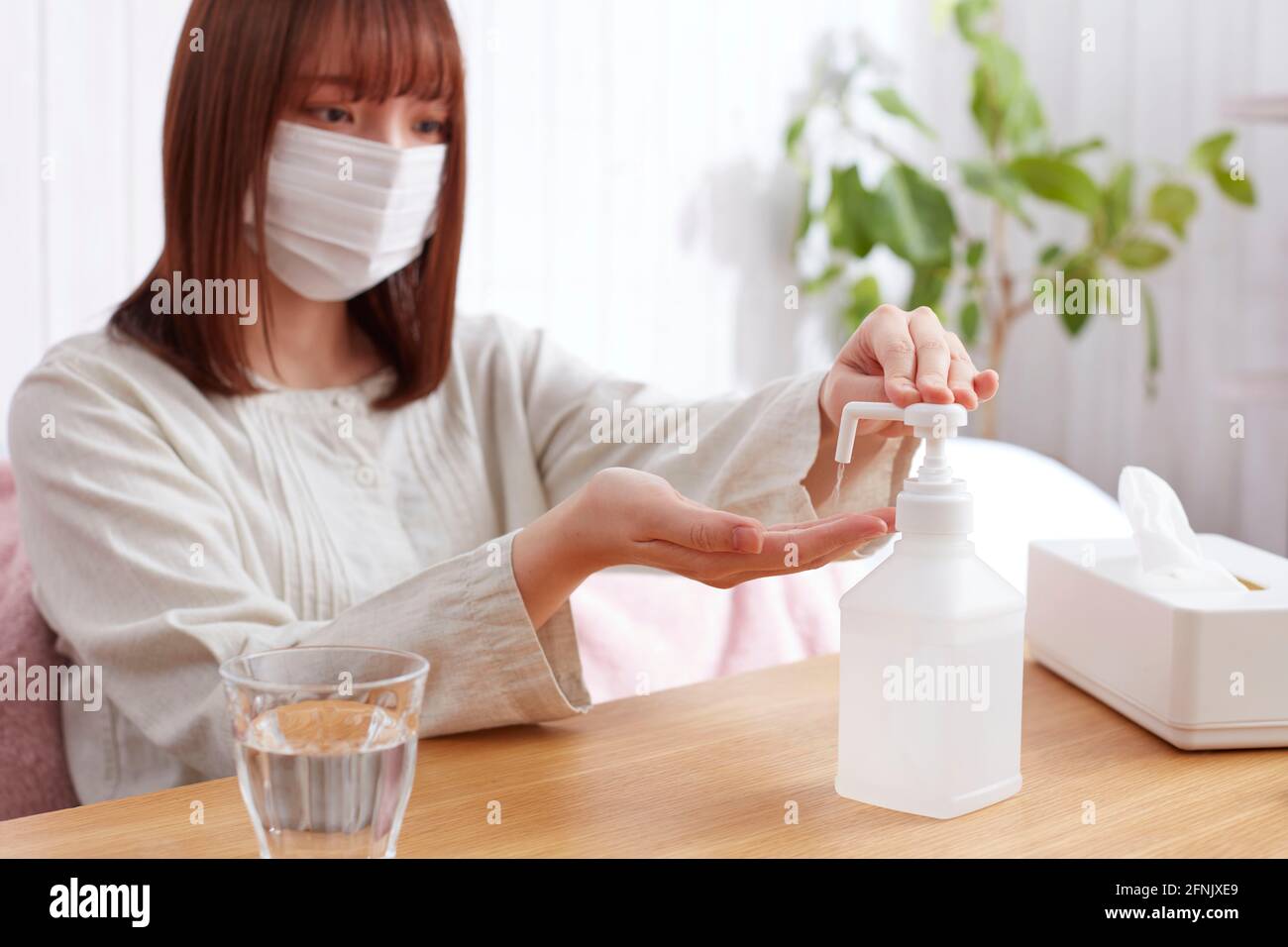 Japanese woman using pulse oximeter Stock Photo Alamy