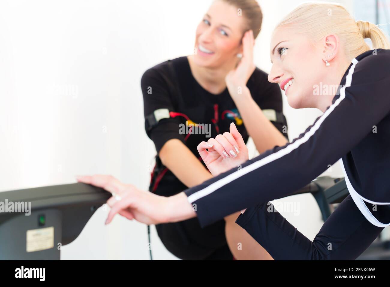 Nms Exercise Female coach woman nms electro muscular stimulation exercise Stock ...