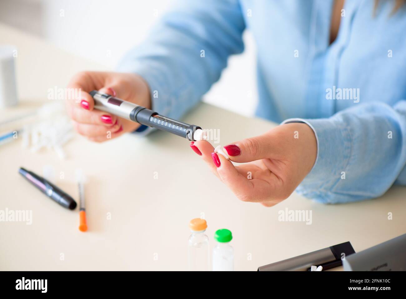 Woman taking blood sample with lancet pen. Diabetes Stock Photo Alamy