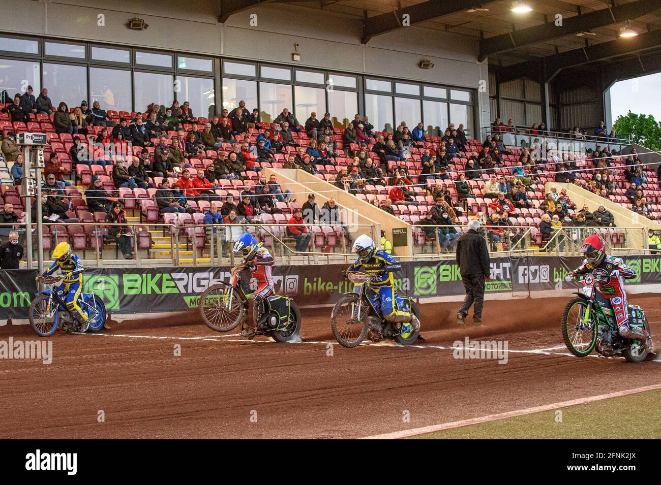Manchester, UK. 17th May, 2021. MANCHESTER, UK. MAY 17TH The start of a heat in front 0f fans: (l-r) Kyle Howarth (Yellow), Tom Brennan (Blue) Troy Batchelor (White) and Charles Wright (Red) during the SGB Premiership match between Belle Vue Aces and Sheffield Tigers at the National Speedway Stadium, Manchester on Monday 17th May 2021. (Credit: Ian Charles | MI News) Credit: MI News & Sport /Alamy Live News Stock Photo