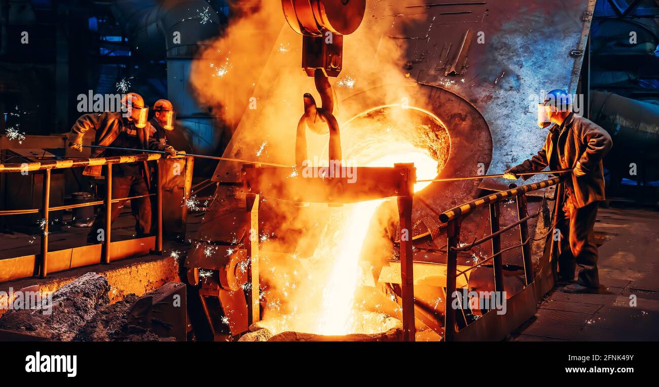 Cast iron process, liquid molten metal pouring in ladle, industrial