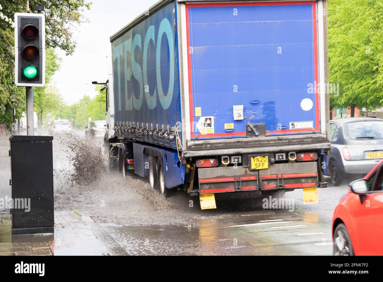 TESCO lorry makes Splash from flash flood on south circular road, greater London, England Stock Photo