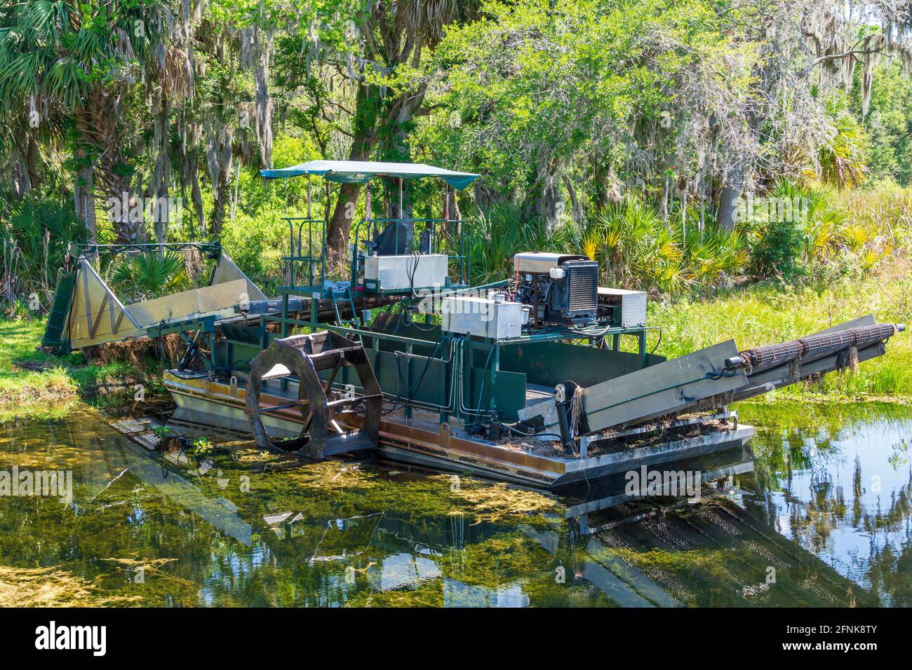 Aquatic weed harvester - Cooter Pond Park, Inverness, Florida, USA Stock Photo