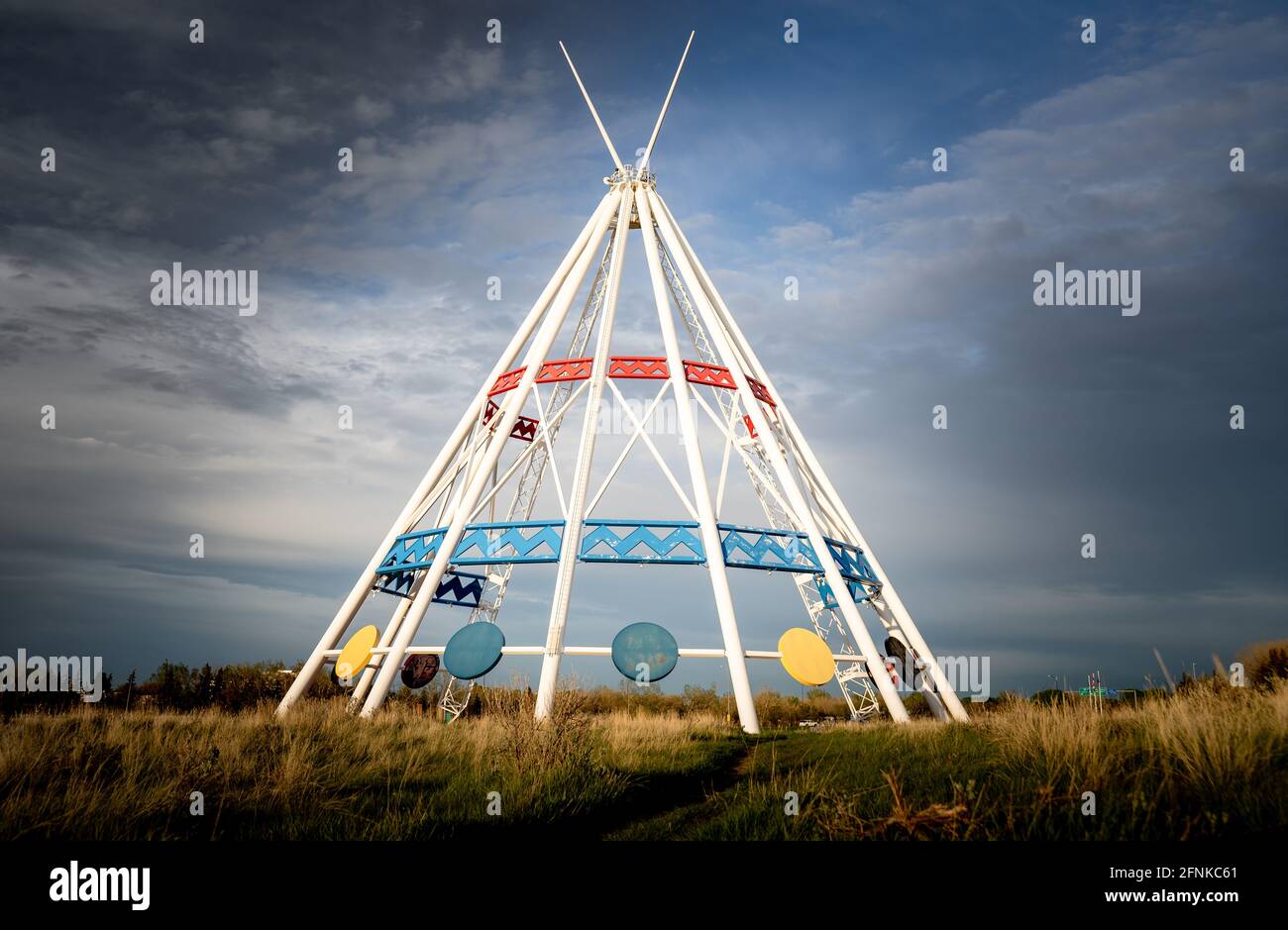 Medicine Hat Alberta Canada, May13 2021: The world's tallest tepee standing under a dramatic sky next to the Trans Canada Hiway in a Canadian city. Stock Photo