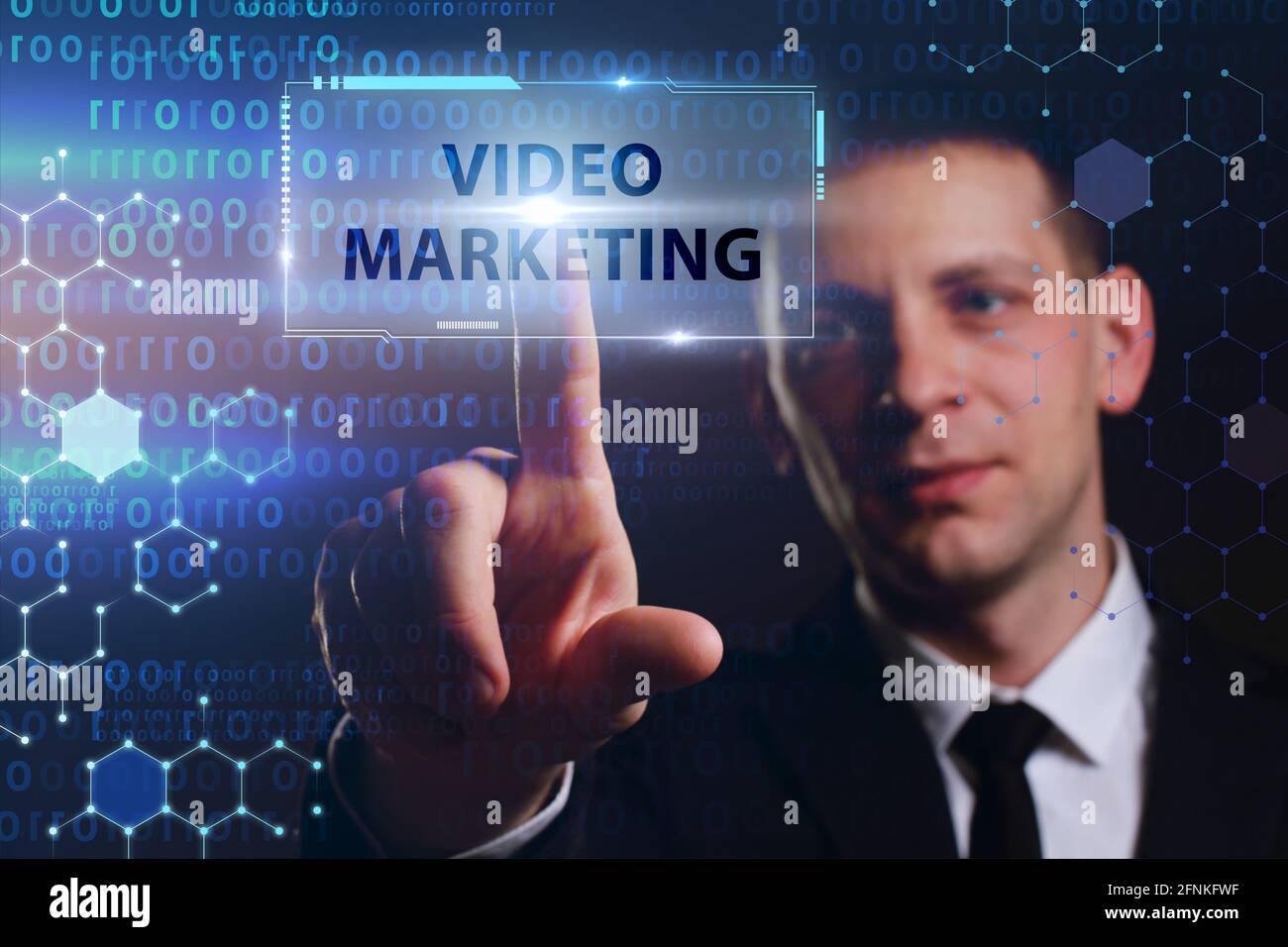 Business, Technology, Internet and network concept. Young businessman working on a virtual screen of the future and sees the inscription: Video market Stock Photo