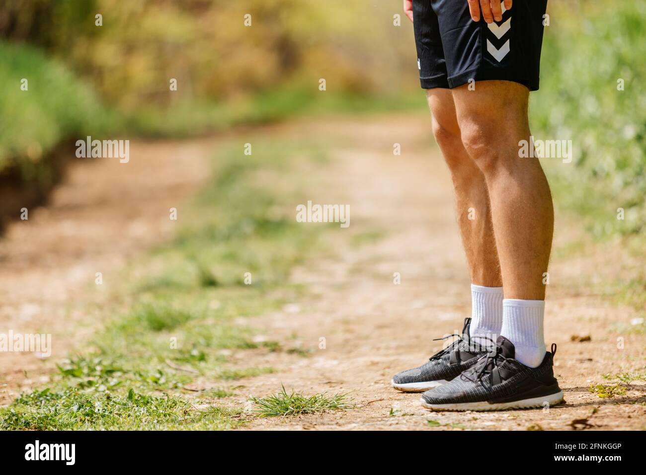 Sport man running. Portrait of runner man jogging in park. Sport