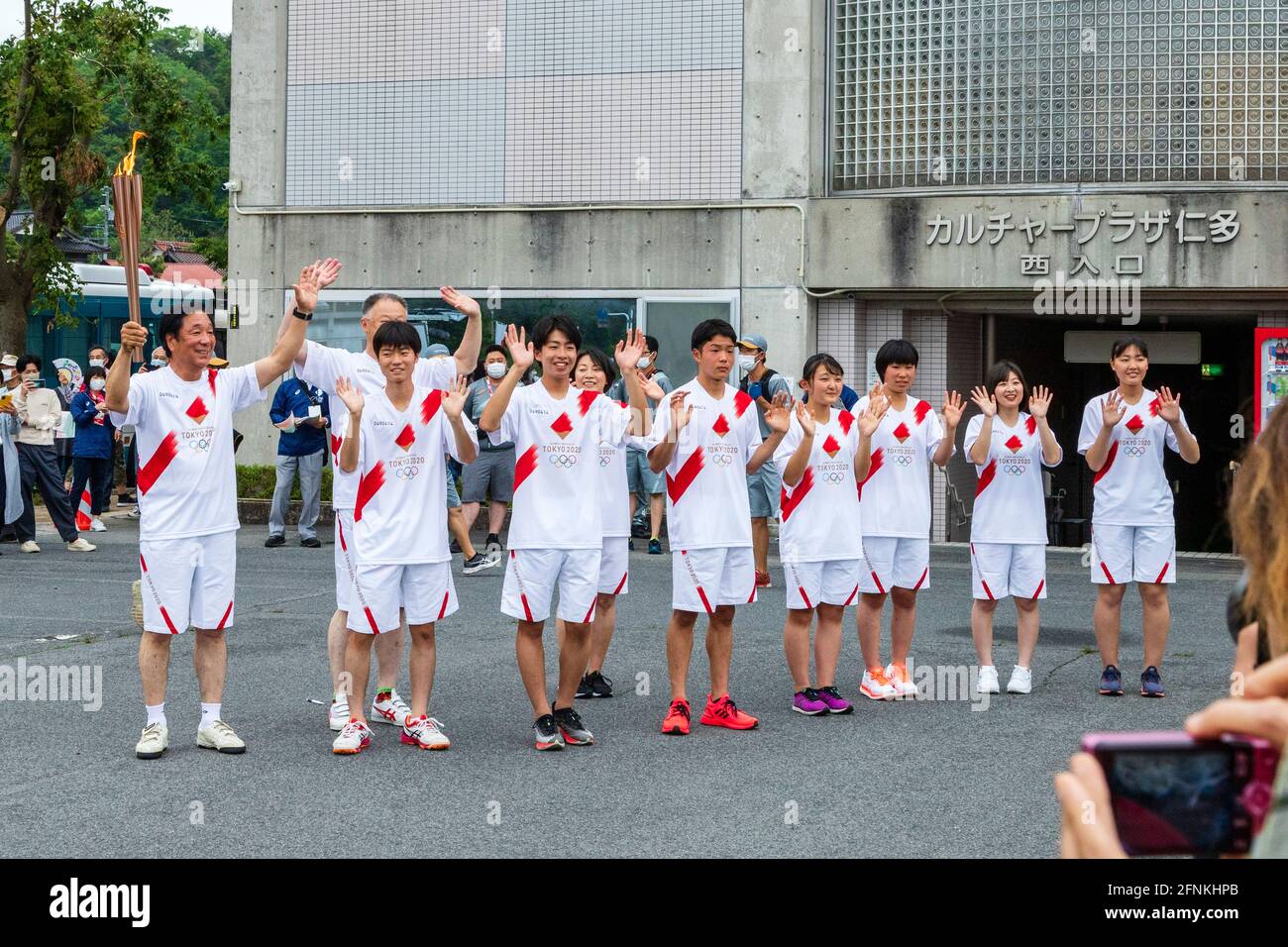 Local torchbearers pose during the Tokyo 2020 Olympic torch relay in Okuizumo Town, Shimane Prefecture, Japan on May 16, 2021. Credit: Ryoji Okamoto/AFLO/Alamy Live News Stock Photo
