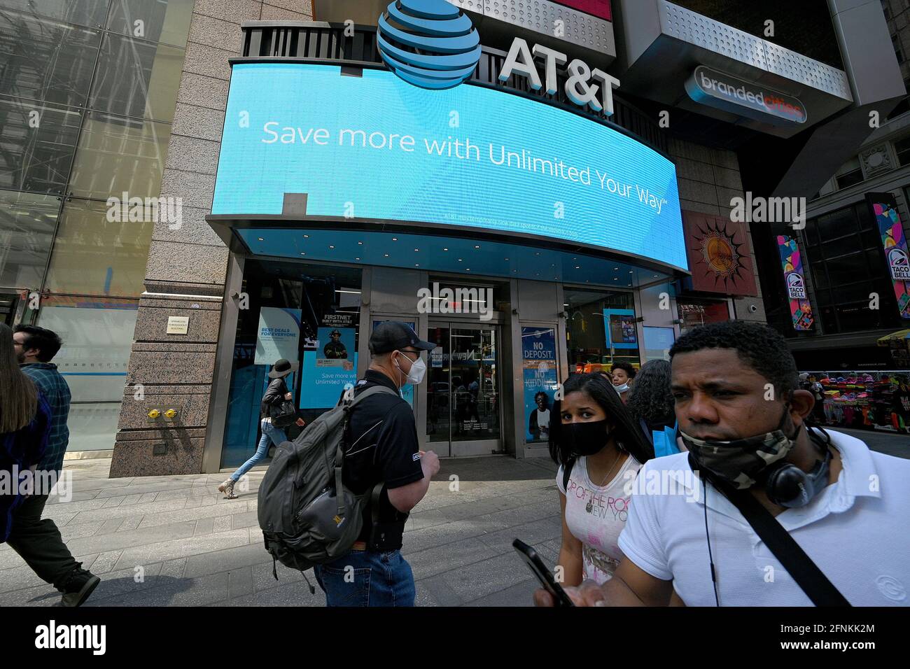 New York City, USA. 17th May, 2021. People walk past an AT&T retail ...
