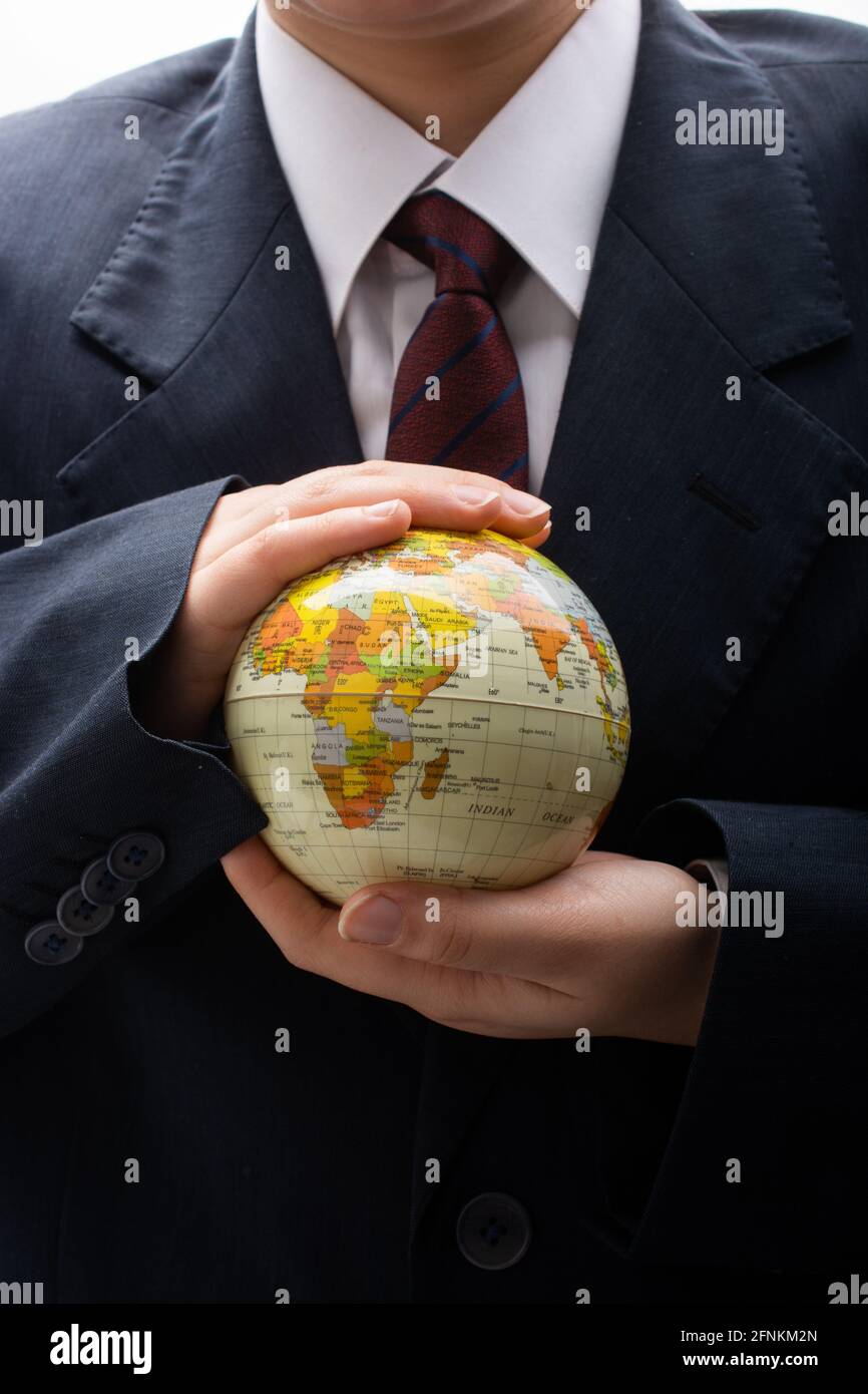 Businessman is standing with an earth globe fot business concept Stock ...